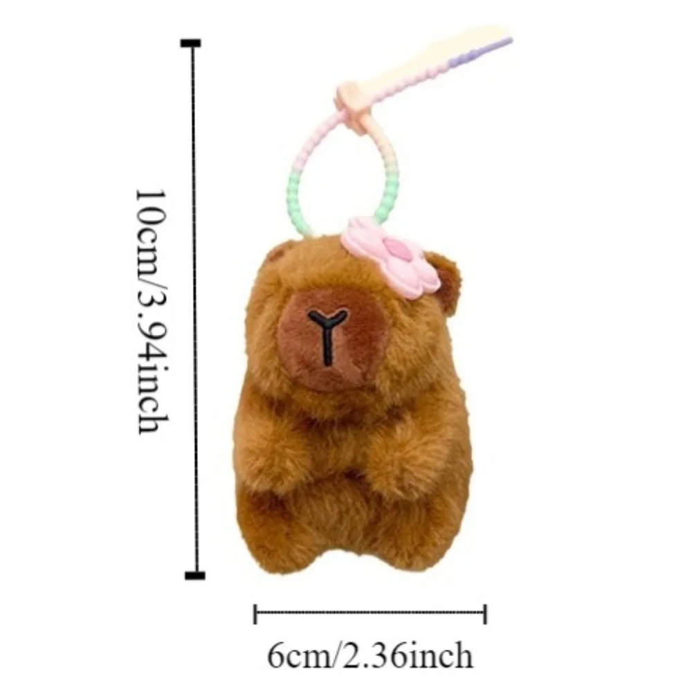 Muñeco de peluche capibara colgante de felpa pequeña flor lindo llavero de capibara de peluche divertido llavero de muñeco de peluche capibara de 10cm