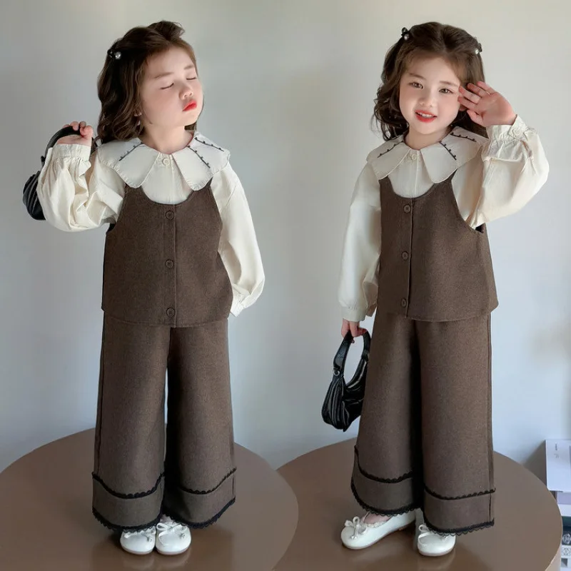 ชุดเสื้อกั๊กเด็กผู้หญิง ชุดฤดูใบไม้ร่วง 2025 ใหม่ทันสมัยและแฟชั่น เสื้อคอปกปีเตอร์แพนสำหรับเด็กผู้หญิง ชุดสามชิ้นหวานๆ สำหรับฤดูใบไม้ร่วง