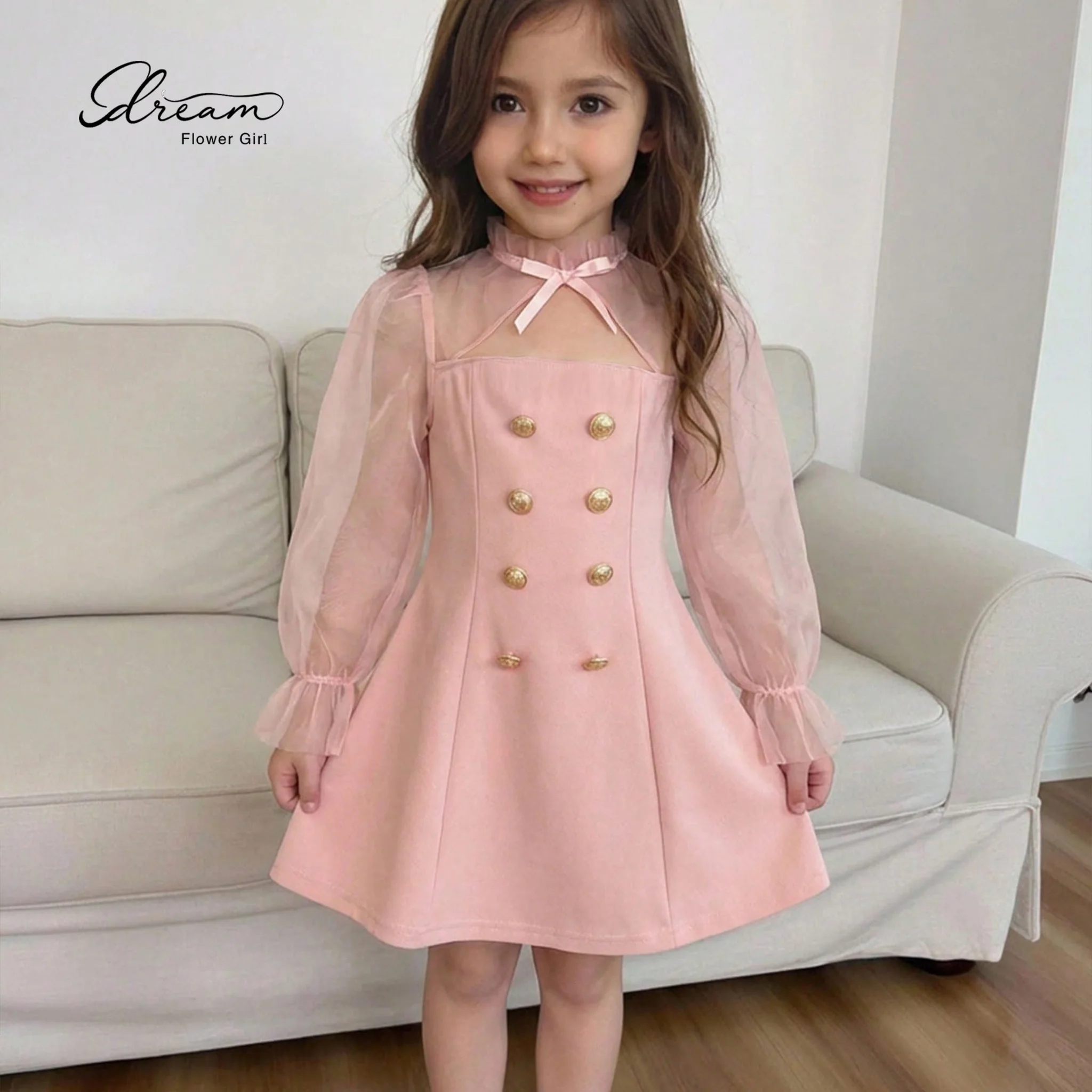 Pink long-sleeved knee-length formal dress for girls featuring a high neck and bow-and-button detailing