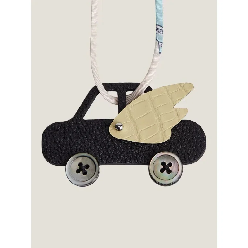 Handmade car, leather wings, genuine leather bag pendant, car pendant, versatile keychain.