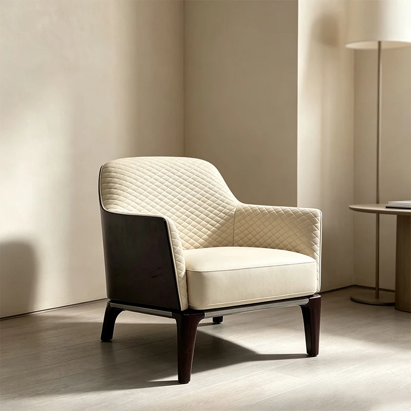 Italian luxury style chair with diamond quilting inside, shell-shaped armchair wrapped in cream leather, suitable for the office