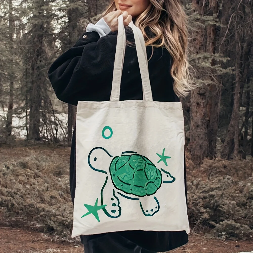 A Turtle pattern print canvas tote bag, suitable for daily use, shopping, school, and travel