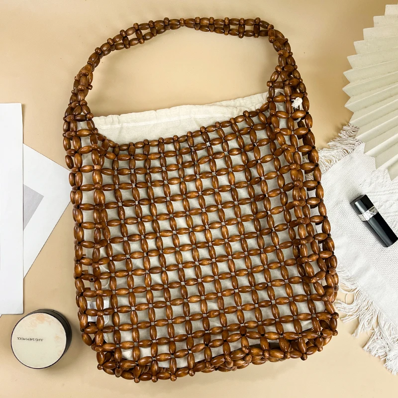 

Fashion leisure niche design hollow woven bead wooden bead shoulder bag beach summer single shoulder large capacity bag