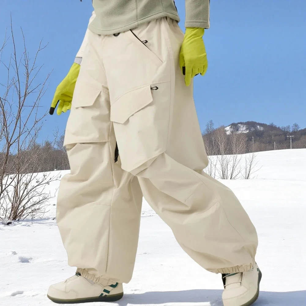 

2025 New Men Baggy Wear-resistant Skiing Pants Women Insulated Loose Pockets Winter Trousers Outdoor Sports Waterproof Clothes