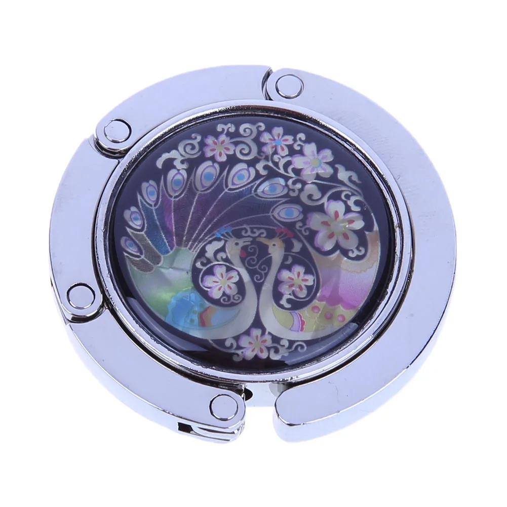 شماعة حقيبة يد قابلة للطي بخطاف محفظة الطاووس لتخزين حقائب اليد على الطاولة