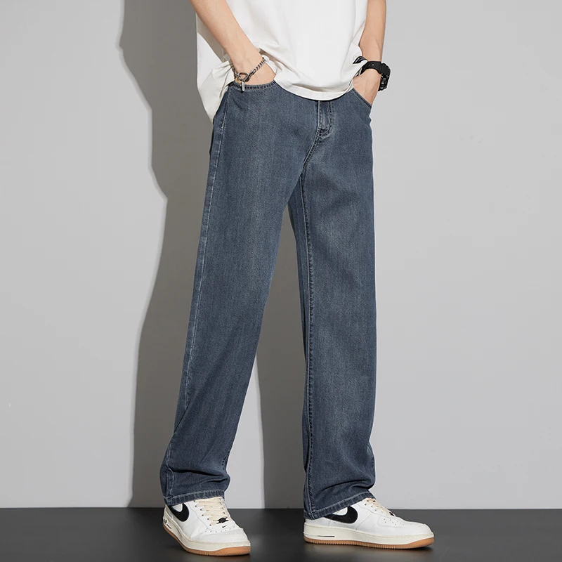 2025 Lyocell verano pantalones vaqueros finos de los hombres de cintura alta sueltos cómodos rectos elásticos pantalones vaqueros de negocios pantalones masculinos
