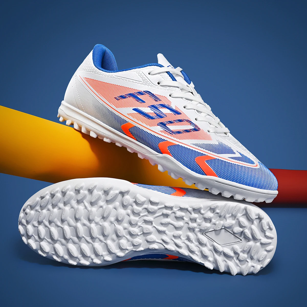 

Fashionable sports style men's TF nail breathable synthetic material and rubber sole football shoes