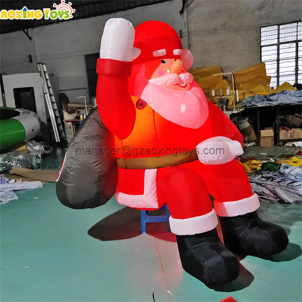 

Outdoor Giant LED Light Inflatable Sitting Santa Claus With Gift Cartoon For Yard Christmas Festival Advertising Decoration