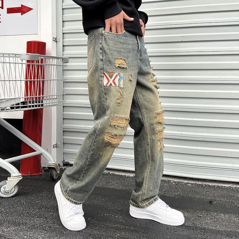 Streetwear Loch Patches lose gerade Herren Jeans Herbst- und Wintermodelle amerikanische Retro High Street Tide Herren lange Hosen