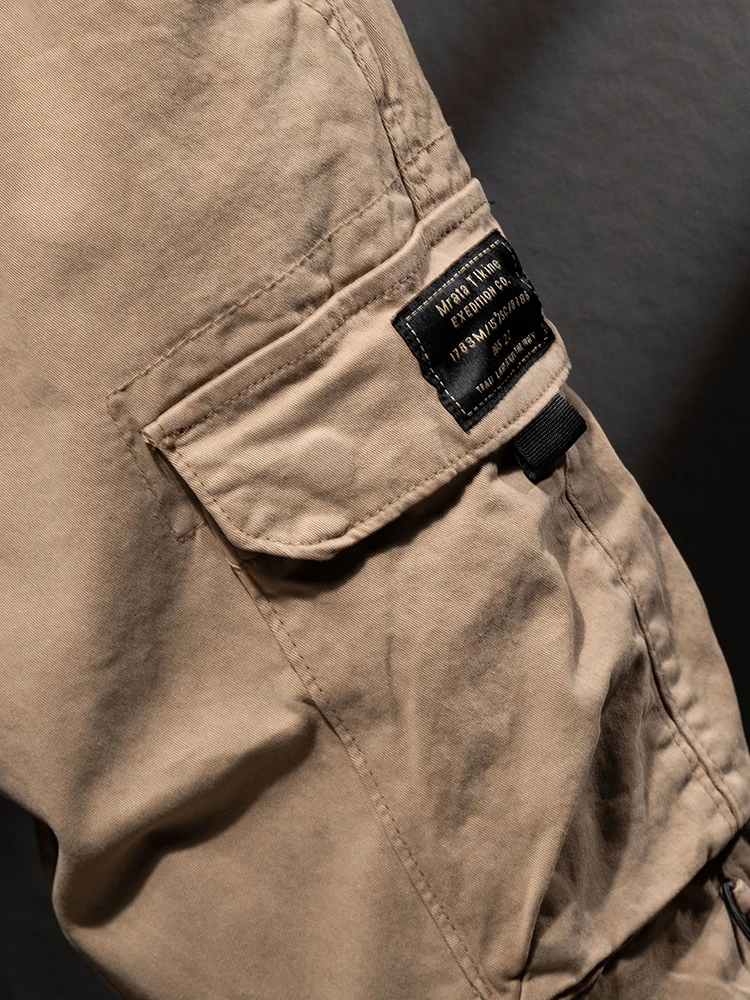 กางเกงทำงานผู้ชายทรงตรงแบบใหม่ปี 2025 สำหรับกิจกรรมกลางแจ้ง ผ้าฝ้ายแท้ สไตล์ลำลอง กางเกงพาราทรูปเปอร์แบบถอดได้ สำหรับฤดูใบไม้ร่วง