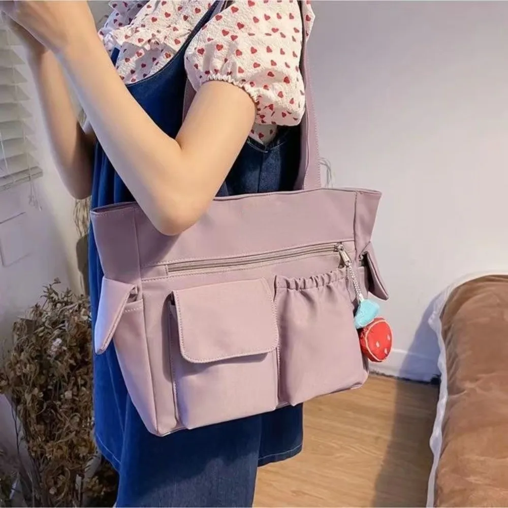 

Nylon Canvas Tote Bag Solid Color Large Capacity Student School Bag Handbag with Strawberry Pendant Japanese Shoulder Bag