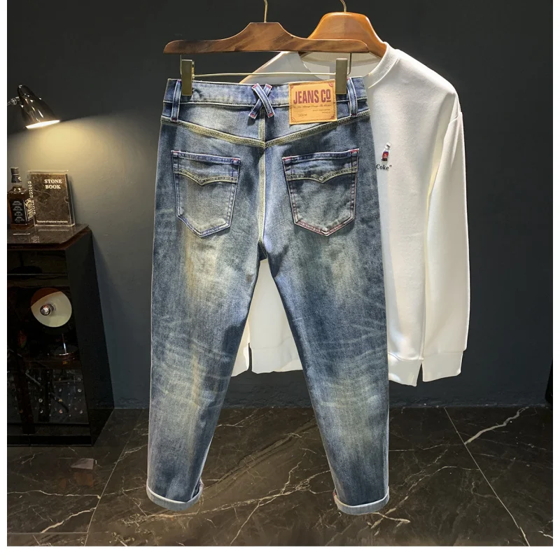 Tren jeans pria baru musim gugur 2025, celana kasual serbaguna berkualitas tinggi, dicuci, elastis, dan nyaman.