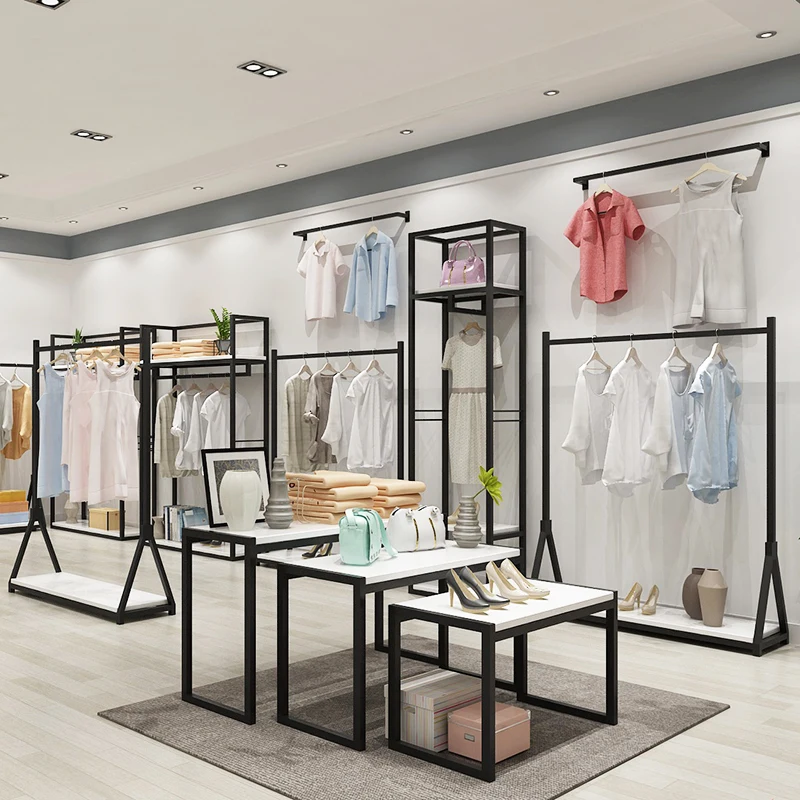 

2025customized.High-end Lady Clothes Display Rack Modern Garment Store Furniture Metal Clothes Rack with Nesting Table