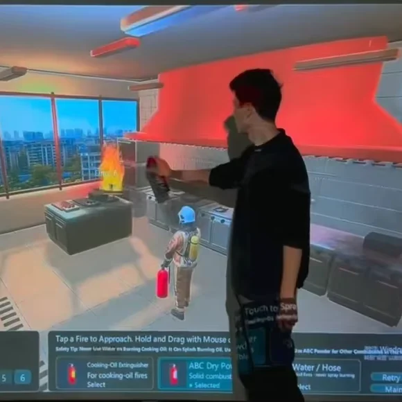 Large-Scale Interactive Firefighting Projection Wall With Laser Extinguishers