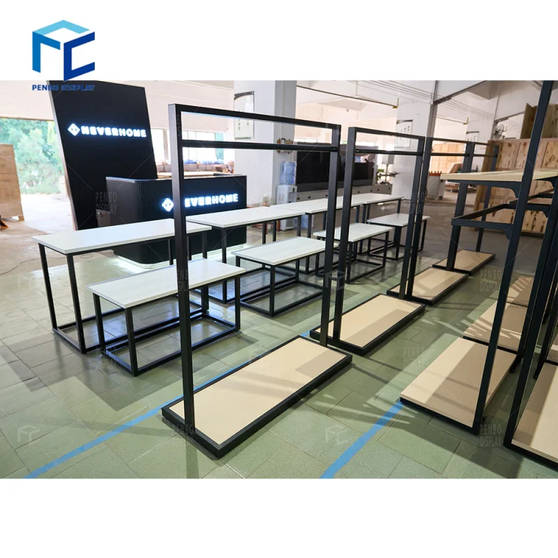 

2025customized. metal clothing display rack standing black wood clothing retail display table racks to display sports cloth