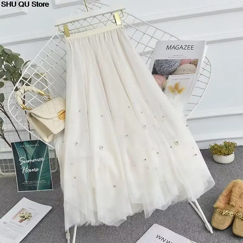 تنورة شاش مطرزة غير منتظمة جديدة لعام 2025 للنساء بخصر عالٍ تنورة عصرية تناسب الجميع على شكل حرف a متوسطة الطول بطول الإناث