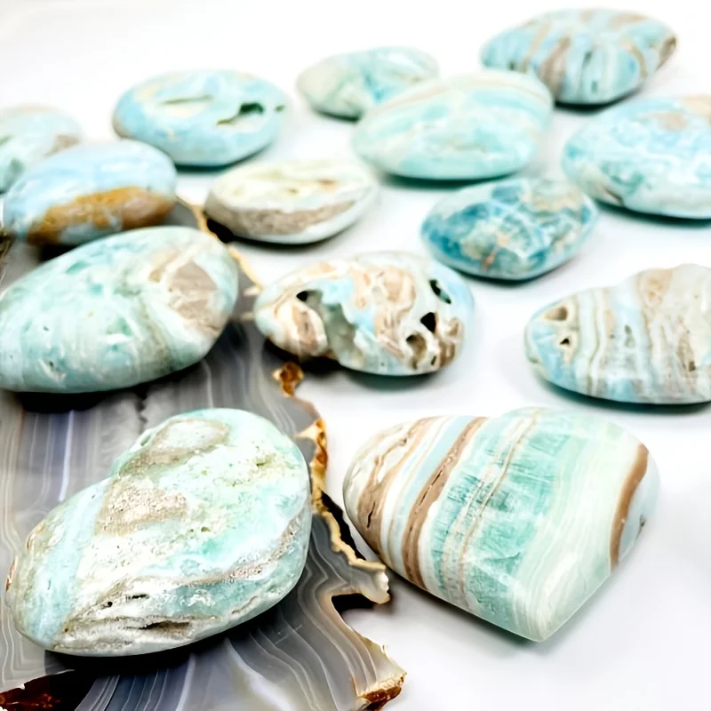 A natural, random Caribbean heart-shaped stone is suitable as a crystal collectible gift.