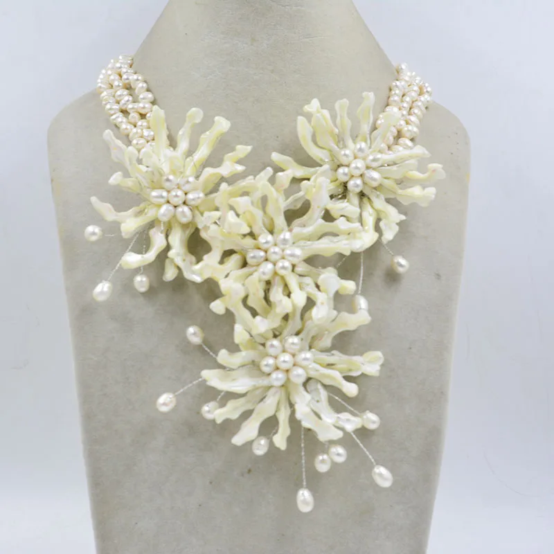 

Classic/Natural White Shell/Pearl. Handwoven flower necklace 20”