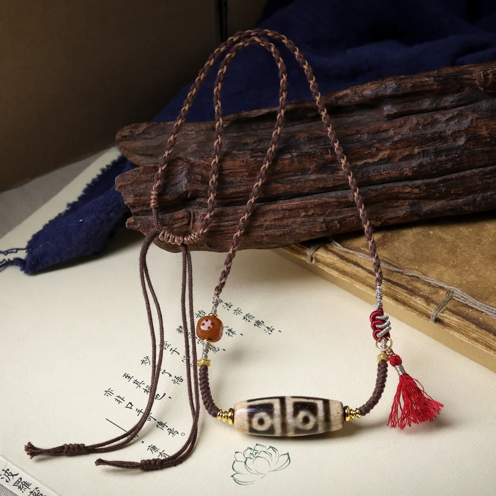 

Tibetan ornaments four-eyed dzi hand-woven collarbone chain original literature play necklace bone dice jumper chain