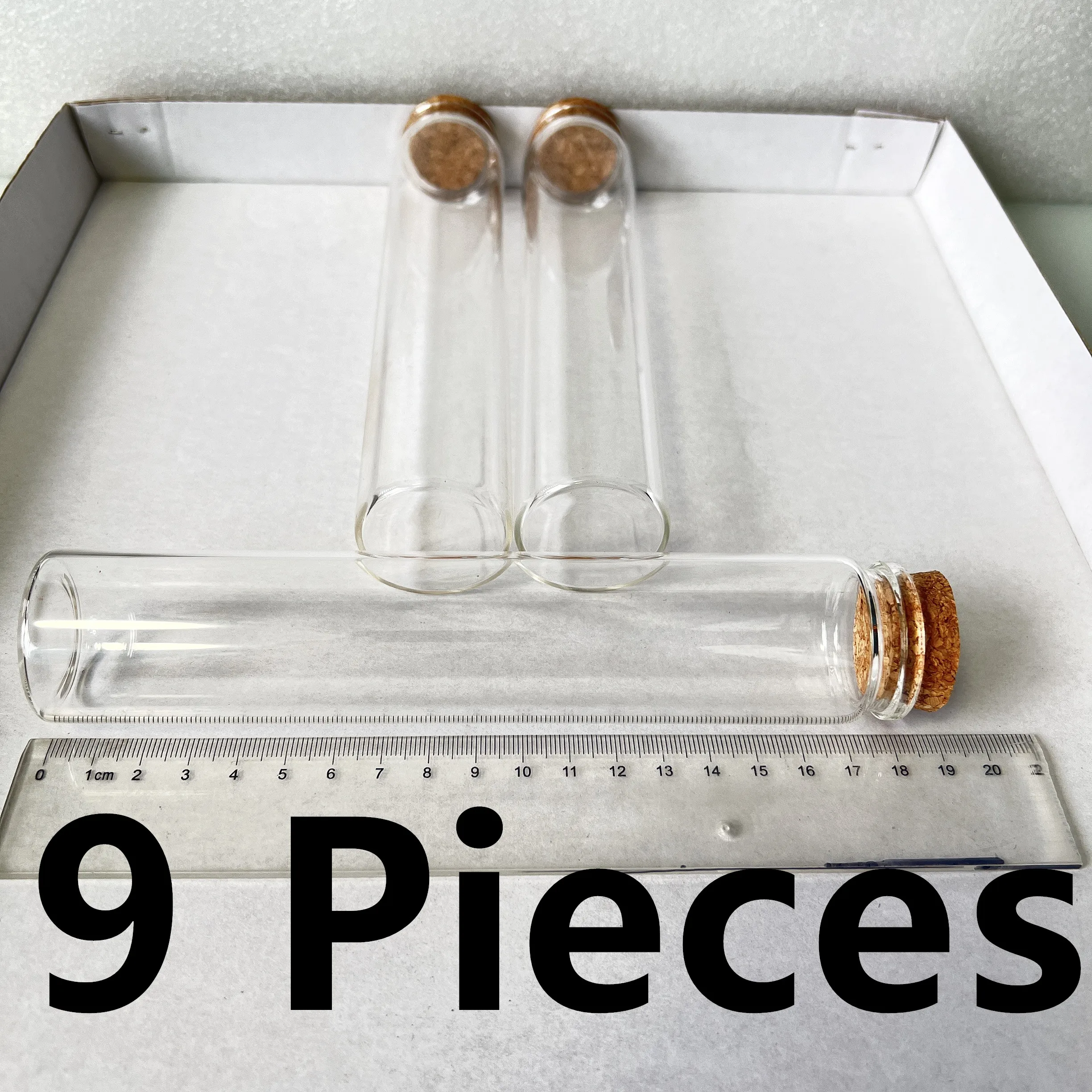 

9 pcs 150ml Glass Bottles with Cork Stoppers - Ideal for Spice Storage, Candy Keeping & DIY Decor. Dimensions: 26×37×180mm