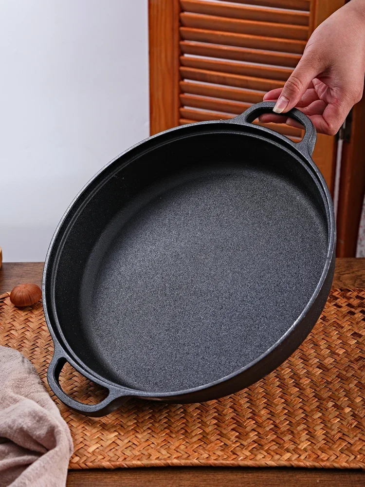 Old fashioned thickened cast iron pan frying flapjack omelette water frying uncoated nonstickgas universal