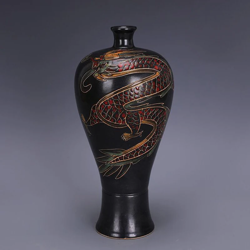 Replica of a Song Dynasty Ding ware black porcelain plum vase with painted dragon design, antique and collectible.