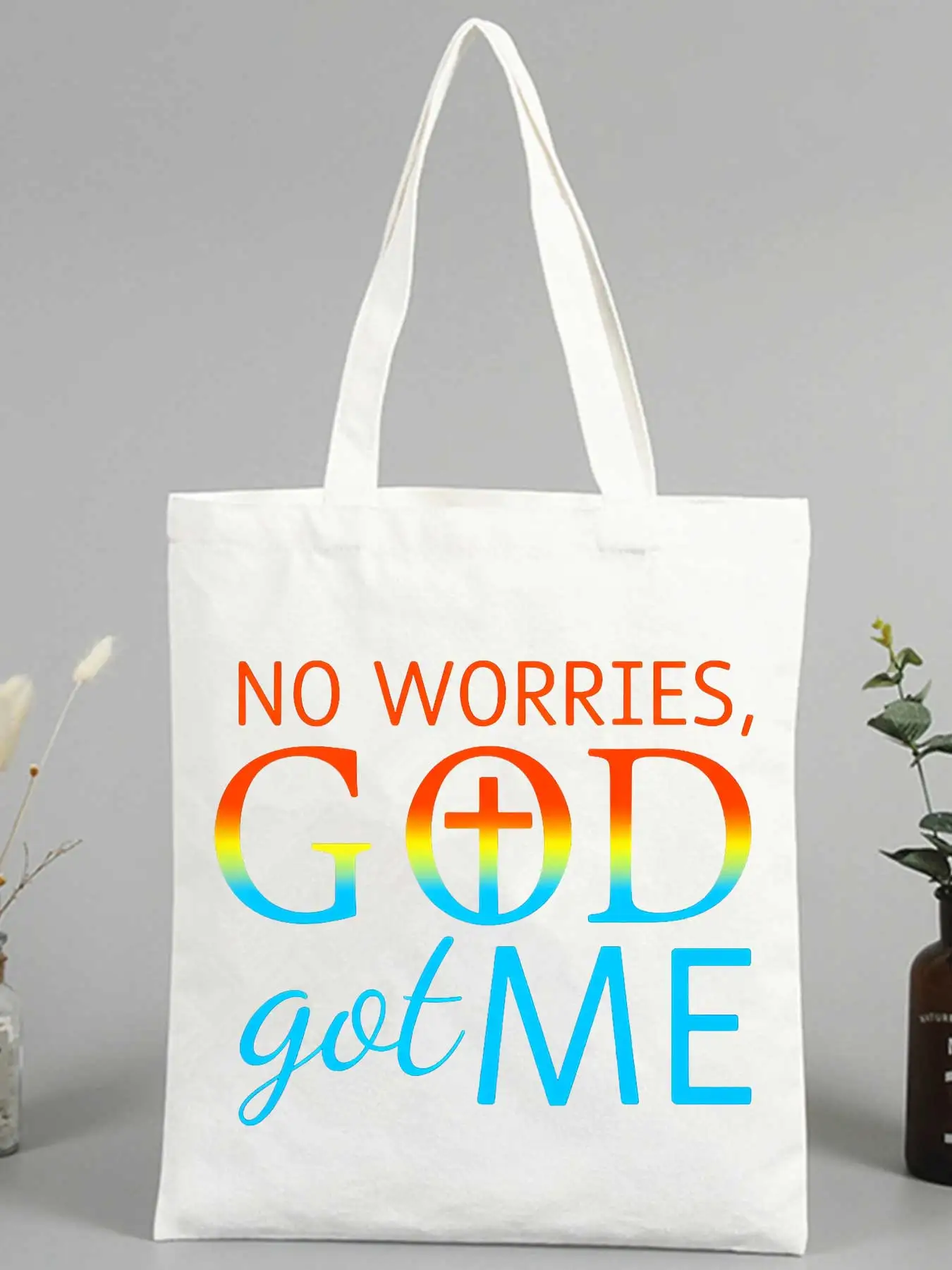 Women's slogan-style canvas tote bag with cross and letter print, ideal for casual daily use and shopping