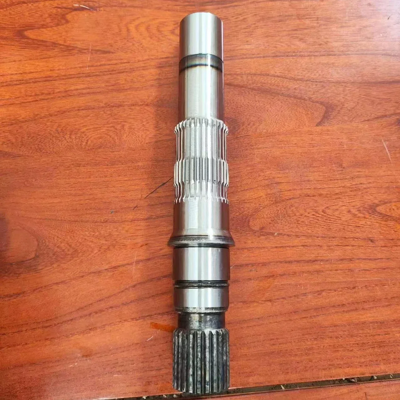 

Вал гидравлического двигателя 90М75 21 зубьев