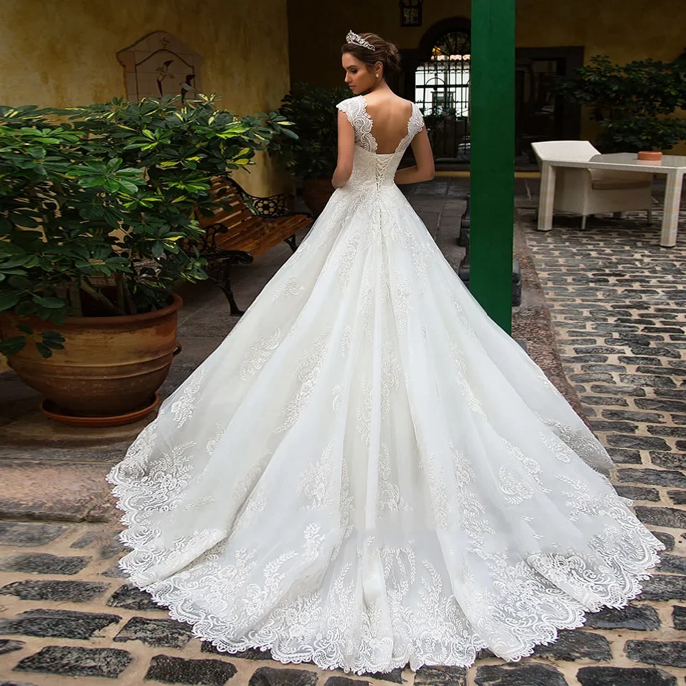 فساتين زفاف Flavinke مخصصة من Vestidos De NoivaTulle فساتين زفاف بأكمام قصيرة فاخرة بأربطة من الخلف رداء رائع De Mariage