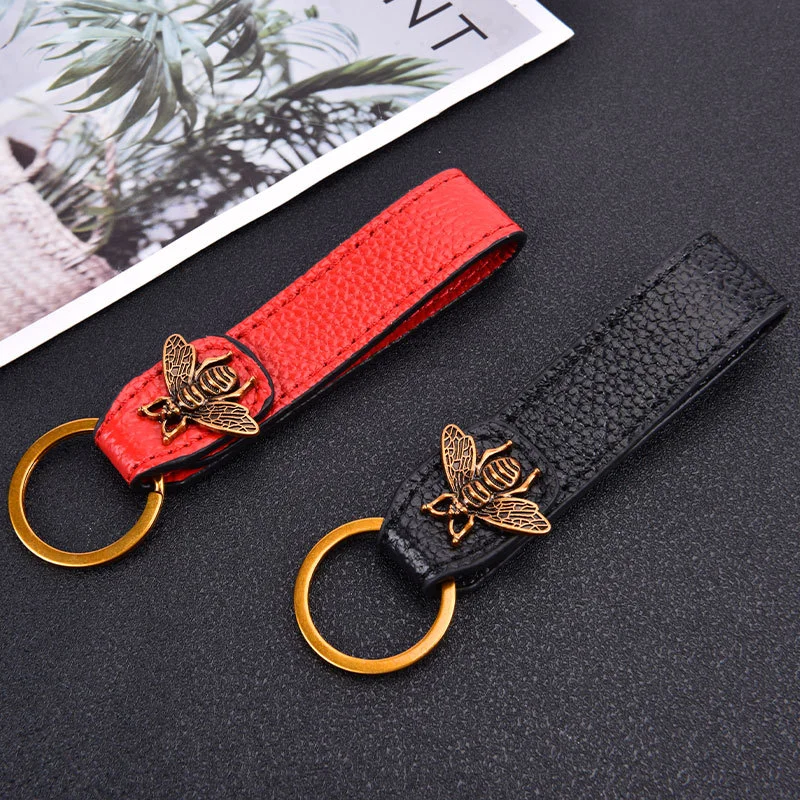 Marka modowa luksusowy design breloczki wysokiej klasy złota pszczoła skórzany biznesowy brelok do kluczyków samochodowych dla mężczyzn nowy brelok na nadgarstek zapobiegający zgubieniu