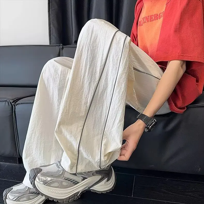 Été mince ample droit pantalons décontractés hommes jeunesse étudiant américain décontracté conception réfléchissante à la mode Sport pantalons longs