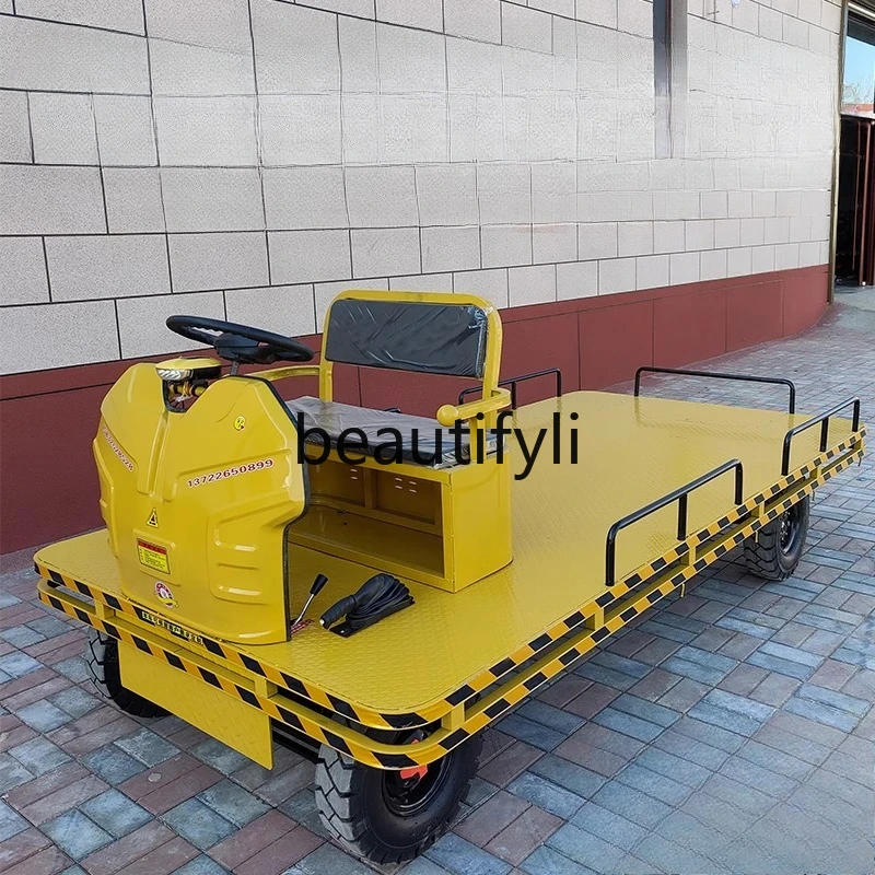 

Electric four-wheel flatbed truck pulling truck steering wheel type factory site high-power transportation tractor