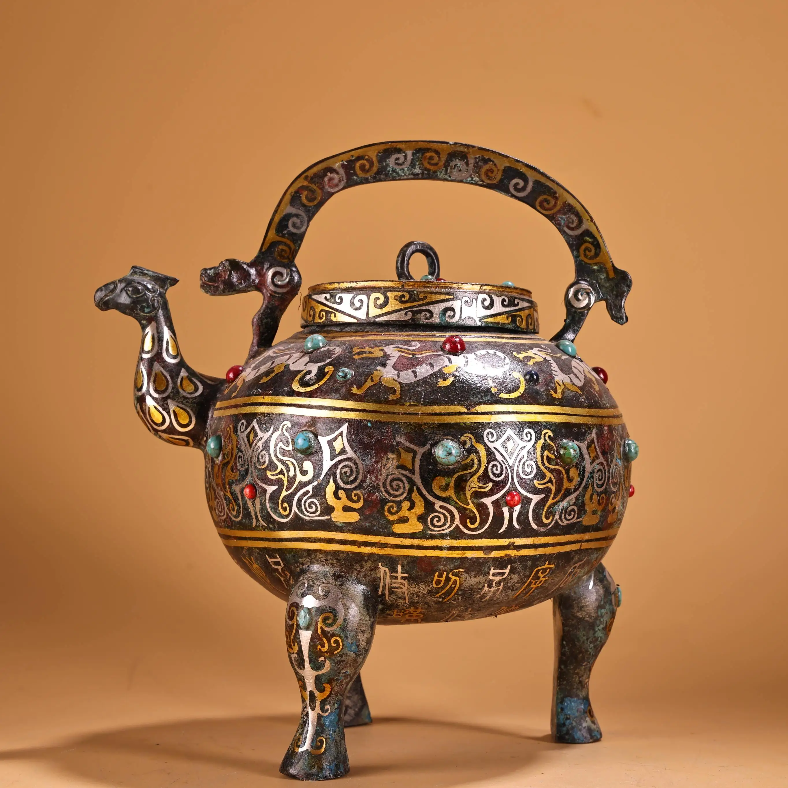 

9"Tibetan Temple Collection Old Bronze Gilded Oracle bone script Pattern Mosaic Gem Bird beak Handle Pot Three legged teapot