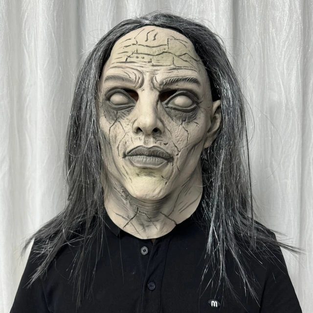 Creepy witch Halloween mask with cracked face, white eyes and long grey hair
