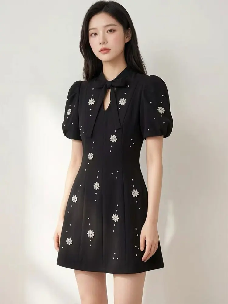 Retro 2026 autumn new solid color bubble sleeve bow collar nail drill slim high waist A-line skirt fashion elegant mini dress.