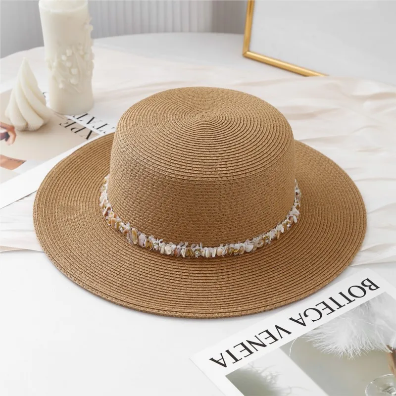 A decorated hat with flat top and large brim to show off the face small sun-protective for women by seaside