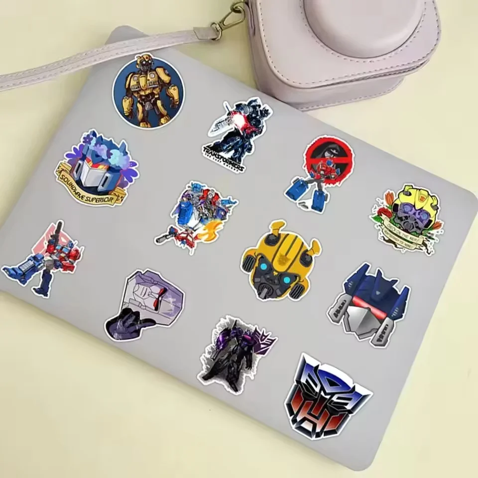 50 ชิ้นสติกเกอร์ออโต้บอท ทรานส์ฟอร์เมอร์สสำหรับแล็ปท็อปรถจักรยานยนต์รถสเก็ตบอร์ดกระเป๋าเดินทางจักรยานสติกเกอร์กันน้ำสติ๊กเกอร์ของเล่นเด็ก