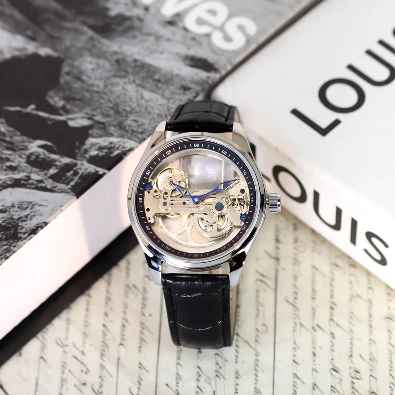 

A men's silver and black leather belt minimalist party watch with hollow Arabic numerals and fully automatic mechanical movement