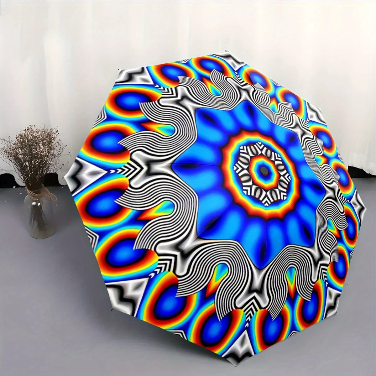 

Автоматический складной зонт с психоделическим, волнистым синим и радужным узором мандалы. Портативная складная конструкция, повседневный аксессуар для активного отдыха.