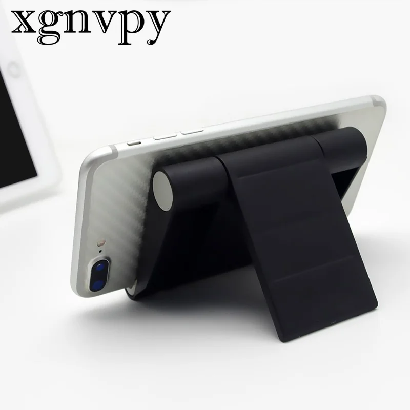 xgnvpy    Universal Tablet & Phone Holder - Portable, Adjustable iPad Stand, Flexible Support for Any Device