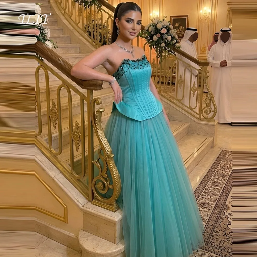 فستان سهرة أنيق من TLIT باللون الأزرق الداكن من الساتان والتول بدون حمالات فستان حفلات مزين بالكريستال وسحاب فيستدوس دي فييستا