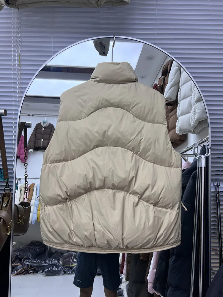 سترة نسائية قصيرة ذات ياقة واقفة بدون أكمام شتوية جديدة فضفاضة بلون سادة مع فيونكة بيضاء على شكل بطة أسفل سترة