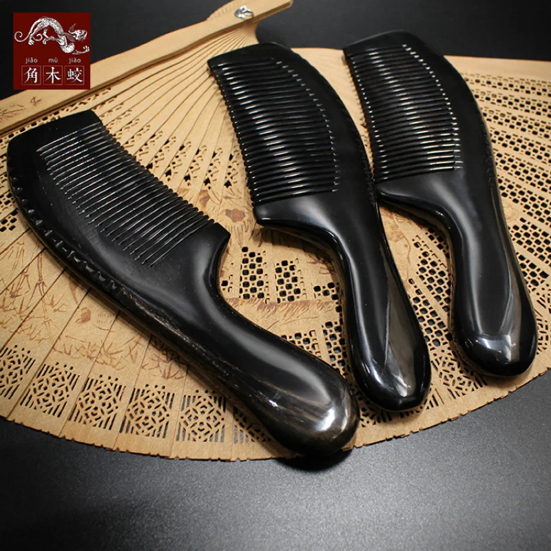 

Black buffalo horn comb with wooden handle, Guangxi massage comb