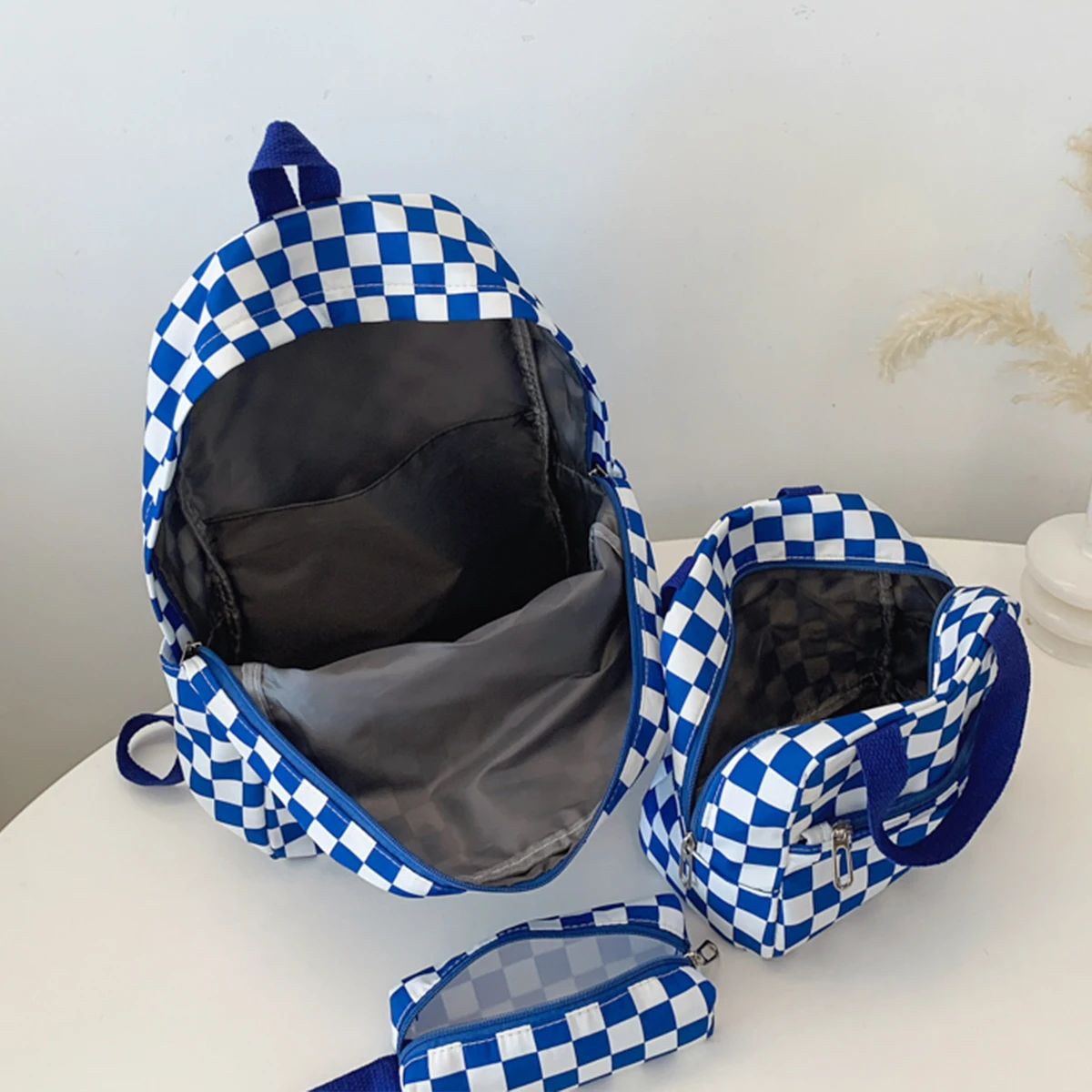 مجموعة حقيبة ظهر منقوشة عصرية مكونة من ثلاث قطع حقيبة ظهر وحقيبة يد ومقلمة وخياطة متباينة ومنظمة متعددة الجيوب لحياة الحرم الجامعي