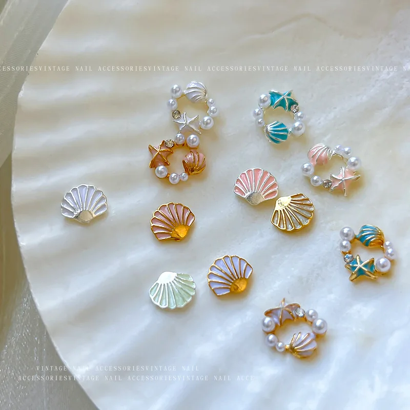 Exquisito y bonito corona de perlas de concha, estrella de mar, diamantes de imitación de Metal, joyería de aleación para playa y mar, accesorios para decoración de uñas
