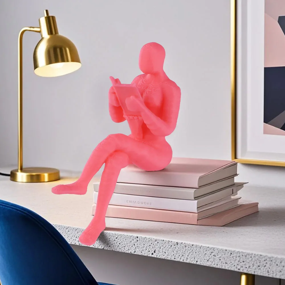 A pink reader statue, suitable for decoration on bookshelves or desks