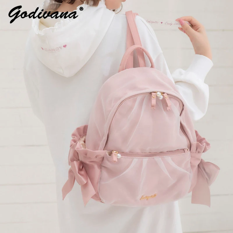 Mochila de malla con lazo para niña, morral escolar suave de estilo japonés, color negro y rosa, novedad