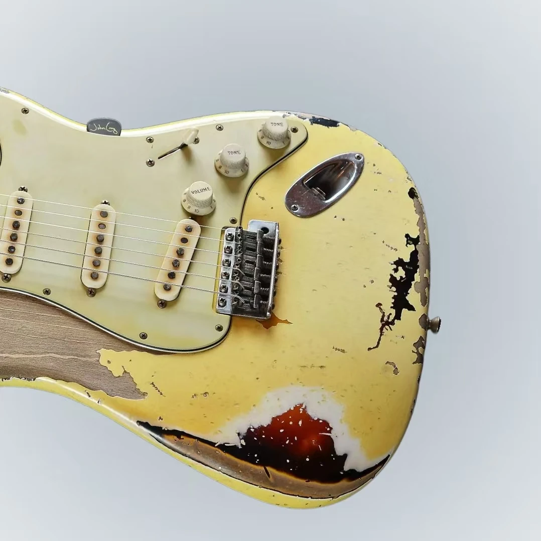 

High-quality yellow vintage electric guitar, retro tuner