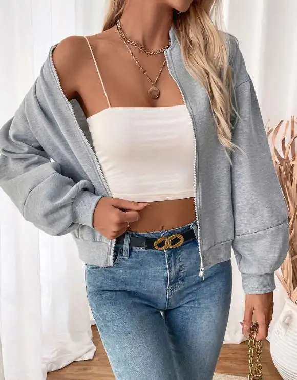 ゆったりとした女性の春の無地ラウンドネックジッパーフロントランタンスリーブベースボールジャケットは、スポーツや運動に適しています。