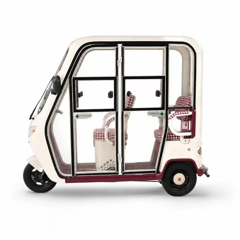 Replace the old and damaged rain curtain, and modify the four-door transparent door of the electric tricycle integrated carport